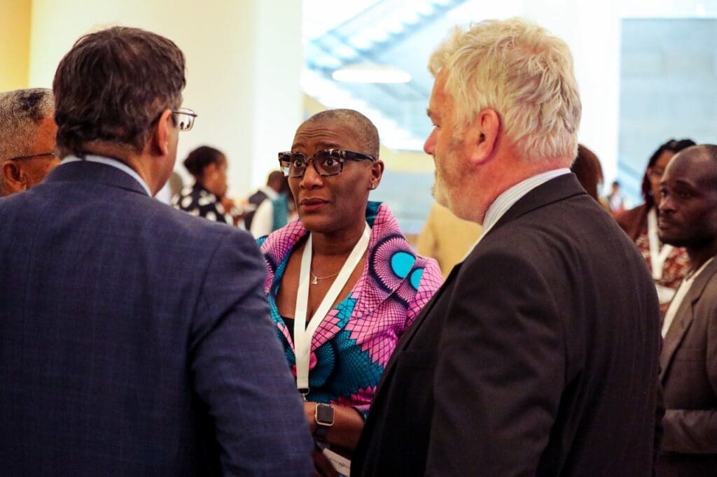 Tallat and Simon discussing climate initiatives with Angola’s UNDP Resident Representative at the International 'Green Card: Clean Energy' Conference